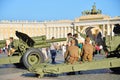 The soldiers sitting on the carriage of a cannon on the Palace s