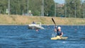 Young sportsman in a kayak in the summer