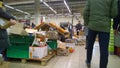 Bankruptcy of supermarket, largest retailer. Clutter, trash and scattered goods on the dirty floor in a store. Mess, huge piles of