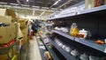 Mess on shelves in the store. Bankruptcy of supermarket, the largest retailer. Clutter, trash and scattered goods on the dirty