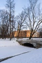 St. Petersburg, Russia, February 4, 2024. Cast iron bridge in the depths of Mikhailovsky Park. Royalty Free Stock Photo