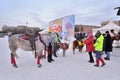 People are photographed with animals - a horse, a deer, a pony d