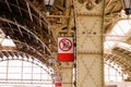 Interior of the Vitebsk railway station. Red vertical Warning sign