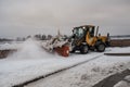 Tractor removes snow from the sidewalk