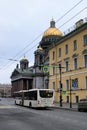 St. Petersburg, Russia, January 2020. View of St. Isaac`s Cathedral from the side of a wide city street.