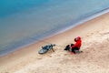 St. Petersburg, Russia - July 10, 2018: fisherman are fishing on the sandy shores of the Gulf of Finland under the bridge