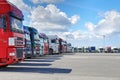 Fleet of trucks with trailer in courtyard of logistics complex. Royalty Free Stock Photo