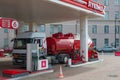 A fuel truck drains fuel at a car filling station Royalty Free Stock Photo