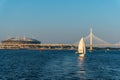 St. Petersburg, Russia, July 2018. Sailing yacht against the backdrop of a cable-stayed bridge at sunset. Royalty Free Stock Photo