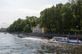 Several walking boat with people swims along the river Fontanka on the background of a