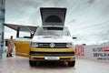 St. Petersburg, Russia - July 22, 2019: White and gold colored modern Volkswagen Multivan California Ocean Bulli Transporter T6.