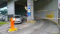 Car leaves the paid multi-level parking lot of shopping entertainment center. Auto wash and quality customer service. Real city Royalty Free Stock Photo