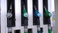 Fuel dispensing pumps green blue and black colour at Petrol station. Gasoline service station. Oil and gas price concept