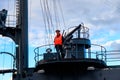 Russian Navy sailor standing near the guns of the cruiser Aurora in Saint Petersburg, Russia