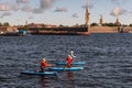 Three girls rowing on SUP boards