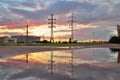 Towers of high voltage power lines and sports-Concert complex St