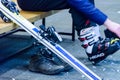 St. Petersburg, Russia - 01.01.2019: a man unfastens ski boots after skiing. Softfocus, blur motion Royalty Free Stock Photo