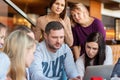 St. Petersburg, Russia-March 24, 2019. A group of four young business people gathered at the table, discussing an interesting idea Royalty Free Stock Photo