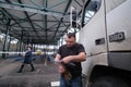 Truck driver with a package of declarations at customs