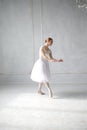 Young woman dances a solo ballet.