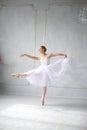 Young woman dances a solo ballet.