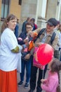 ST. PETERSBURG, RUSSIA - May 8, 2015: A female volunteer on the eve of Victory Day on the street near the station distributes St.