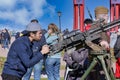 An Islamist takes aim with a machine gun on the street of Petersburg