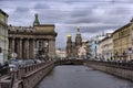 The granite embankment of the Griboyedov Canal in St. Petersburg on a wet cloudy autumn day