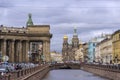 The granite embankment of the Griboyedov Canal in St. Petersburg on a wet cloudy autumn day