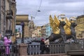 Griffins with golden wings on the Bank Bridge in St. Petersburg.