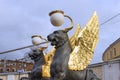 Griffins with golden wings on the Bank Bridge in St. Petersburg