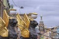 Griffins with golden wings on the Bank Bridge in St. Petersburg