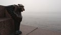 Bronze Griffon and the Neva river in a fog