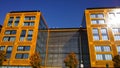 Orange and glass building exterior. Modern architecture. Skyscraper geometry. Business office park. Urban real estate. Economics a Royalty Free Stock Photo