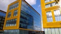 Orange and glass building exterior. Modern architecture. Skyscraper geometry. Business office park. Urban real estate. Economics a Royalty Free Stock Photo