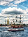 St. Petersburg, Russia 25.07.2023. Tourist ships against the background of the Frigate Standart and the Peter and Paul
