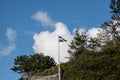 The St Piran flag of Cornwall flying against a blue autumn sky