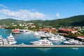 St.Thomas, British virgin island - January 13, 2016: sea port and town on sunny blue sky. Yachts moored at sea pier on mountain la Royalty Free Stock Photo