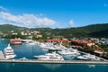 St.Thomas, British virgin island - January 13, 2016: yachts moored at sea pier on mountain landscape. Sea port and town on sunny b Royalty Free Stock Photo