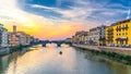 St Trinity Bridge stone bridge and boat on Arno River water and embankment promenade with buildings in historical centre of Floren Royalty Free Stock Photo