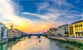 St Trinity Bridge stone bridge and boat on Arno River Royalty Free Stock Photo