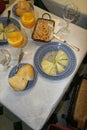 St Tropez, France. A meal of cheese, bread and orange juice on a white table Royalty Free Stock Photo