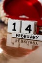 St. Valentine February 14 calendar of wooden cubes from the eternal calendar. Wooden background