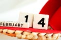 St. Valentine February 14 calendar of wooden cubes from the eternal calendar. Wooden background