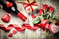 St Valentine's setting with red roses bouquet, present and red w Royalty Free Stock Photo