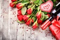 St Valentine's setting with red roses bouquet, present and red w Royalty Free Stock Photo