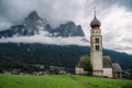 St Valentine's Church, Seis am Schlern, Italy. Schlern mountain with rainy clouds in background