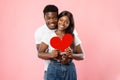 Young Romantic Black Couple Hugging And Holding Red Paper Heart Royalty Free Stock Photo