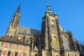 St. Vitus Cathedral with green roof and watch on tower under the sunlights in Prague