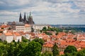 St. Vitus Cathedral over old town red roofs. Prague, Czech Republic Royalty Free Stock Photo